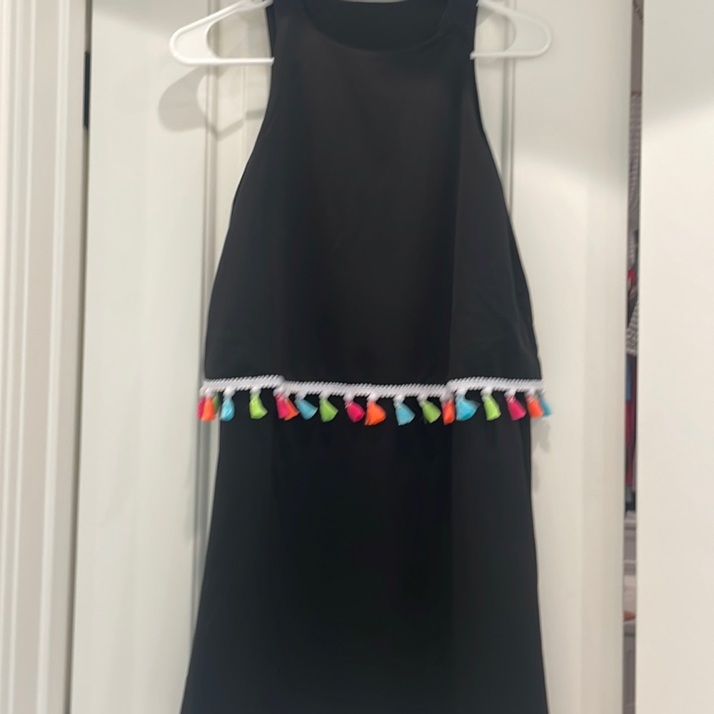 Black with colorful detail. No size on it but it fits like a small.
